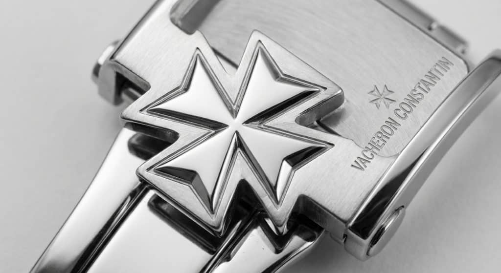 A high-resolution macro perspective reveals the precision-milled internal angles and mirror-polished facets of the Maltese Cross emblem on a ZF Vacheron Constantin Overseas deployment buckle.