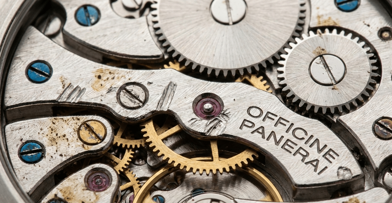 A close-up of a damaged watch movement with mismatched screws and signs of improper handling, illustrating the consequence of substandard repairs.