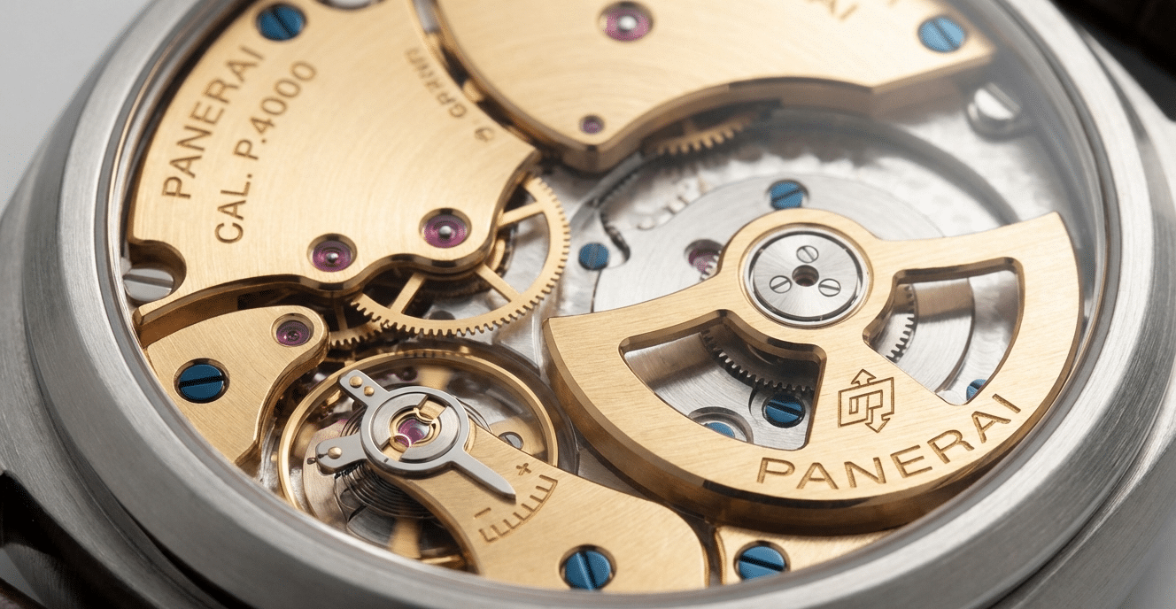 Close-up of a replica watch movement, showing a micro-rotor design, highlighting components contributing to thinness.