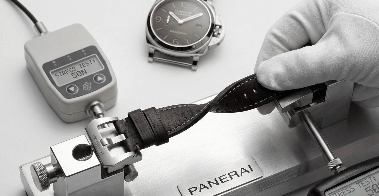 A watch strap being pulled and twisted, illustrating stress testing