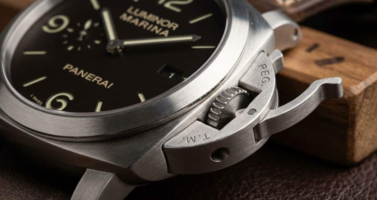 Close-up view of a Panerai crown guard lever, showing its pivot pins and how it secures the crown.