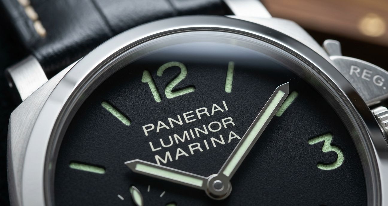 Macro shot of a Panerai sandwich dial, highlighting the crispness of printed numerals and the texture of the lume.