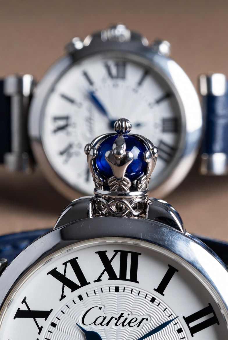 Cartier crown with blue cabochon, showing precise seating and color