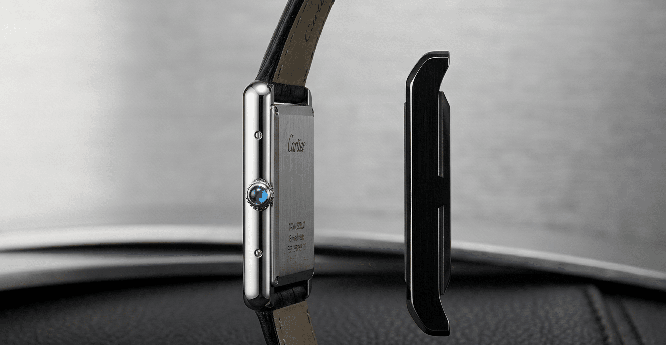 Profile shot of a genuine Cartier Tank Solo highlighting its extreme thinness compared to a thicker replica case silhouette.