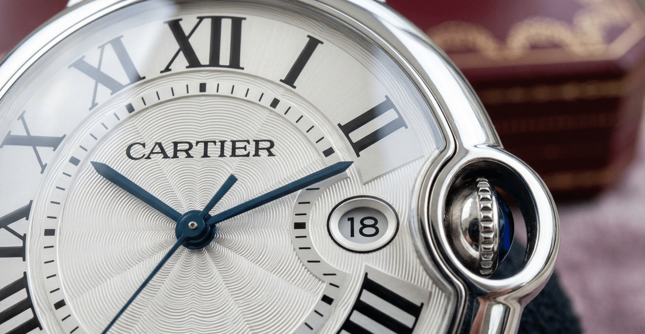 Close-up of a Ballon Bleu crystal dome showing the relationship between the dial surface, date window, and the curved interior of the crystal.