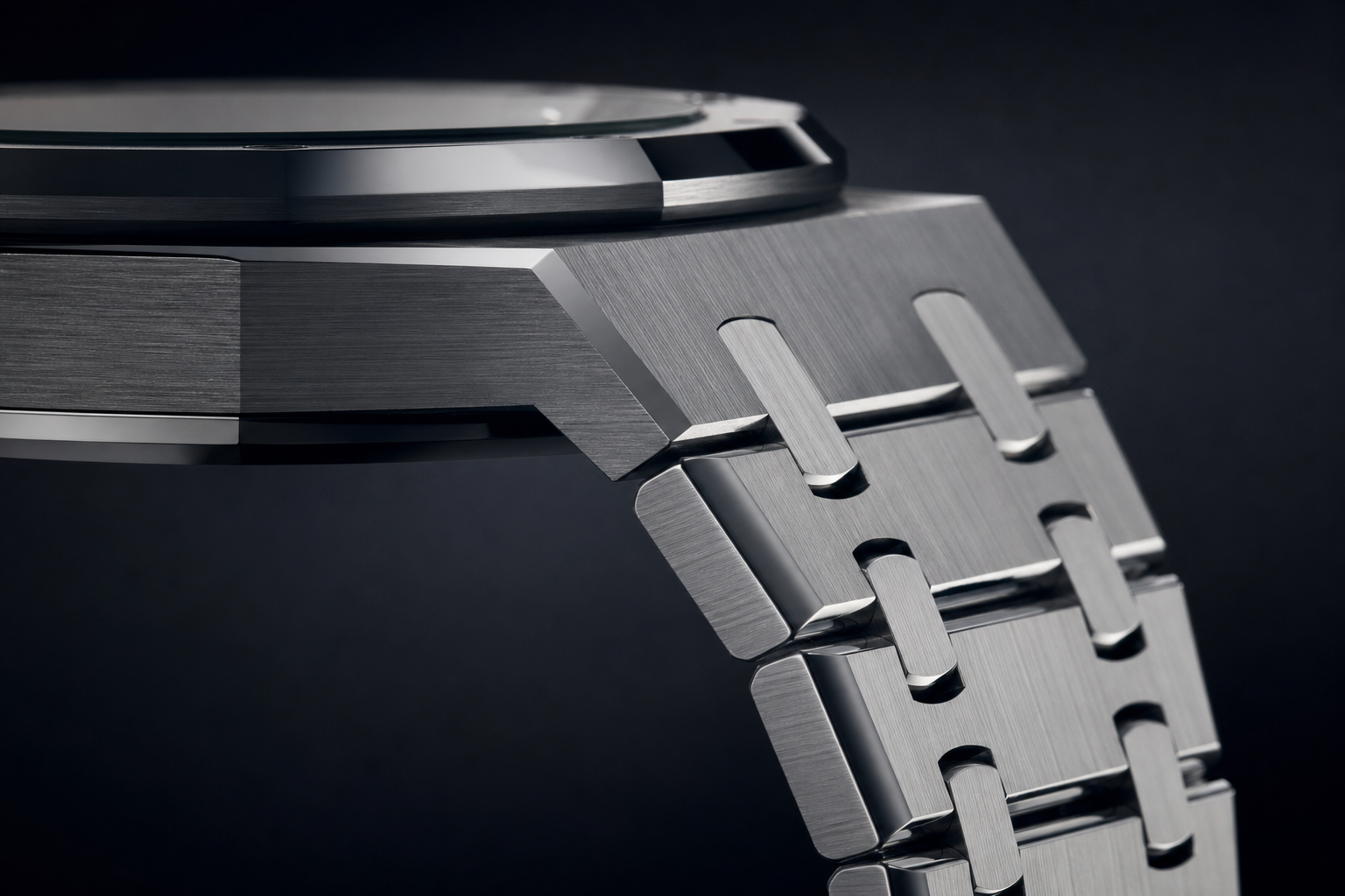 close-up side view of an integrated bracelet transition showing case thickness, link articulation, and the way the bracelet flows from the Royal Oak style case