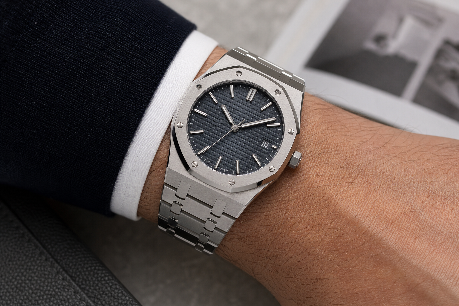 AP-style super clone on wrist showing octagonal bezel, integrated bracelet shape, and visible wrist presence under neutral indoor lighting