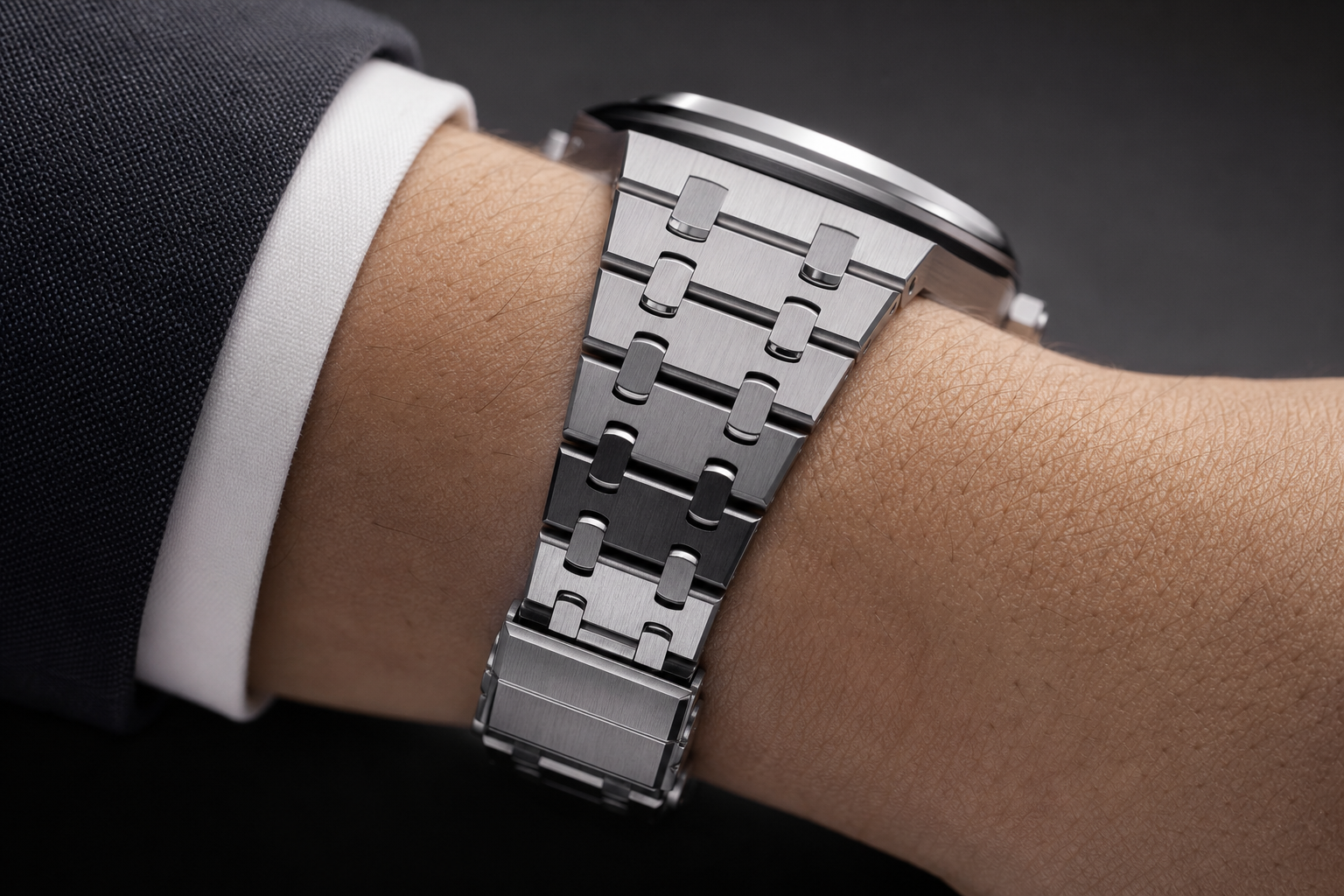 close-up of AP-style integrated bracelet links, clasp area, and wrist fit showing comfort and sizing points