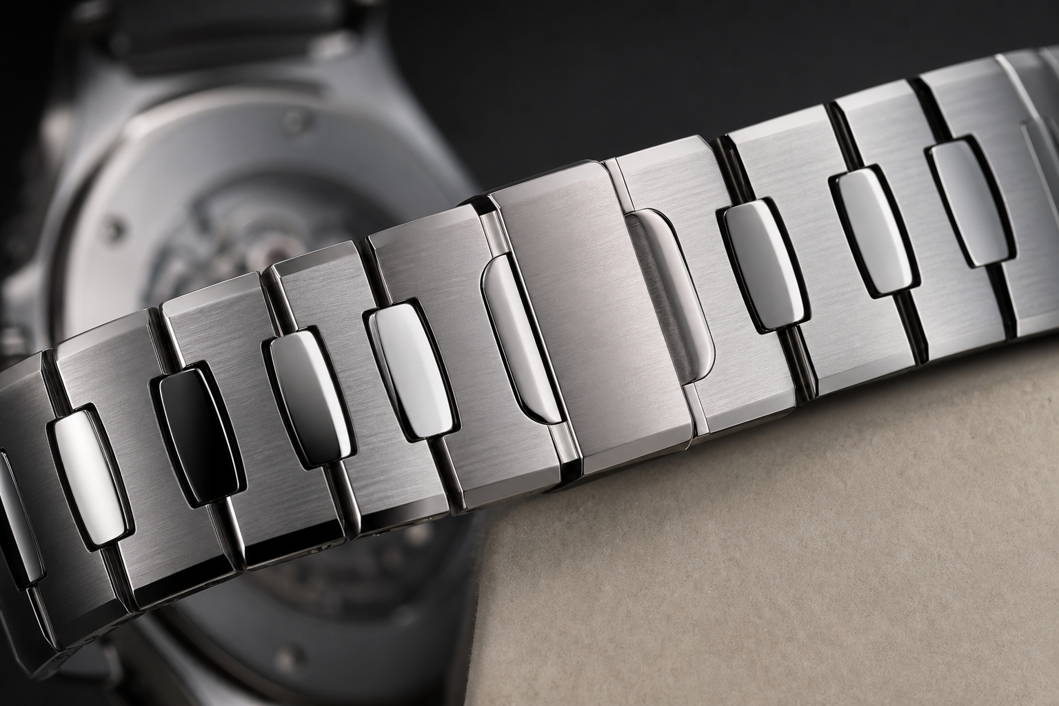 close-up view of an AP-style replica bracelet showing brushed surfaces, polished bevel transitions, clasp fit, and integrated bracelet articulation