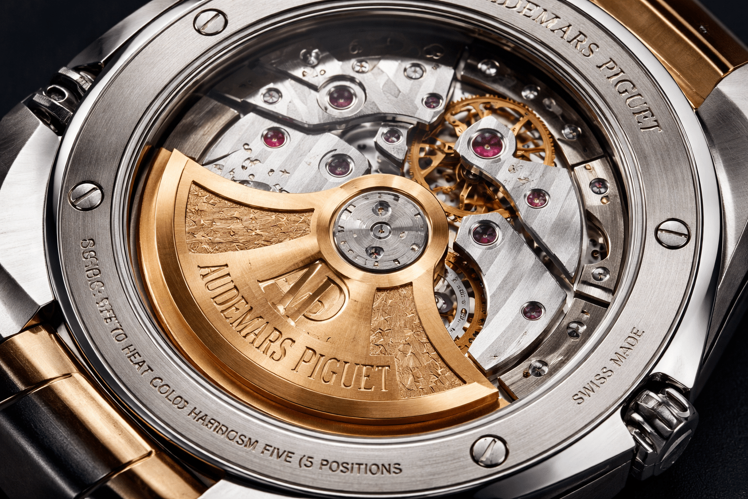 AP replica display caseback movement photo showing rotor, bridge layout, decorative stripes, jewel positions, and engraved text under normal lighting