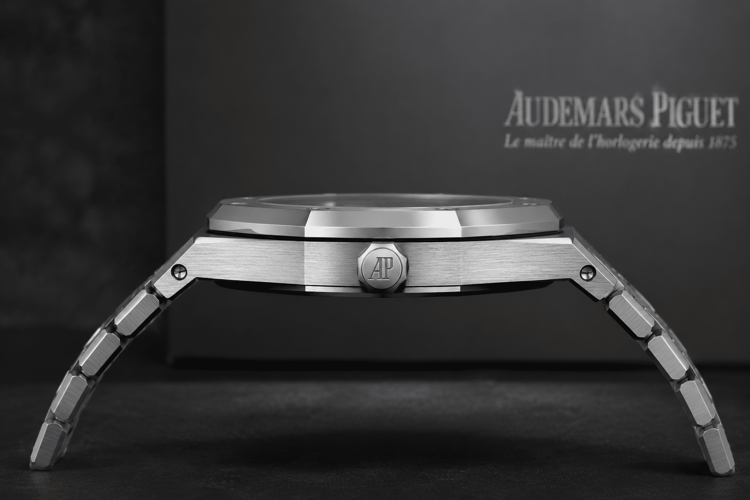 side profile view of AP Royal Oak 15500 replica showing case thickness, bezel edge finishing, polished bevels, and bracelet drop