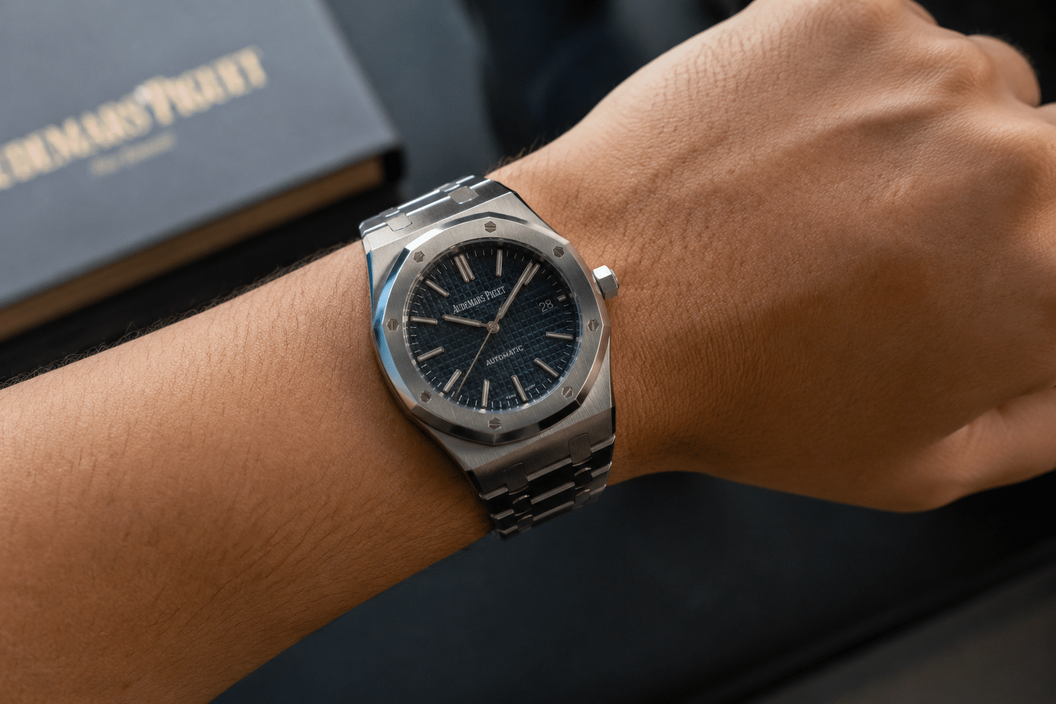 Patek Philippe super clone on wrist after regular daily wear showing bracelet fit, clasp position, and case surface under natural light