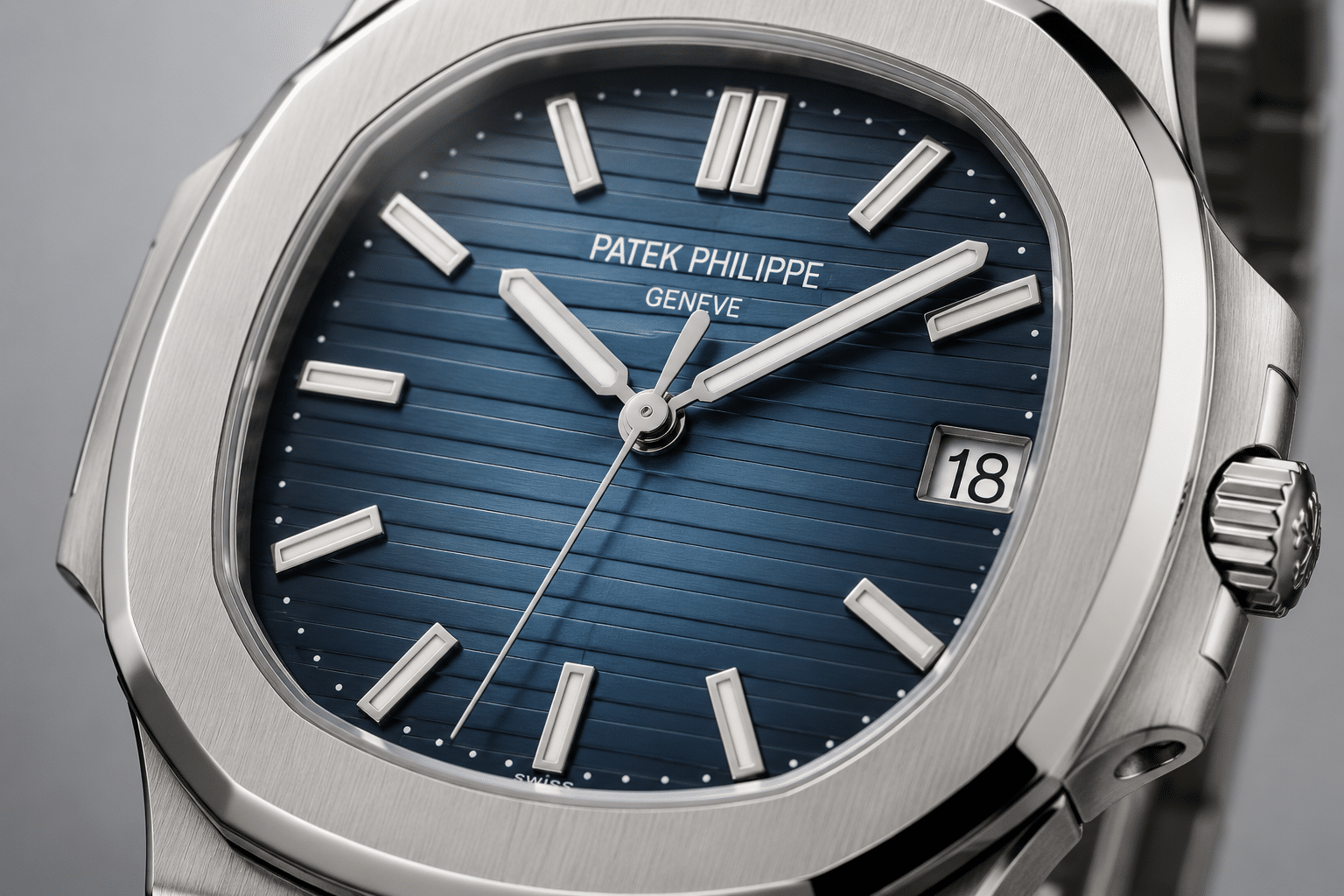 close-up view of a Nautilus 5711 replica blue dial showing center brightness, darker edge gradient, and horizontal dial texture under neutral lighting