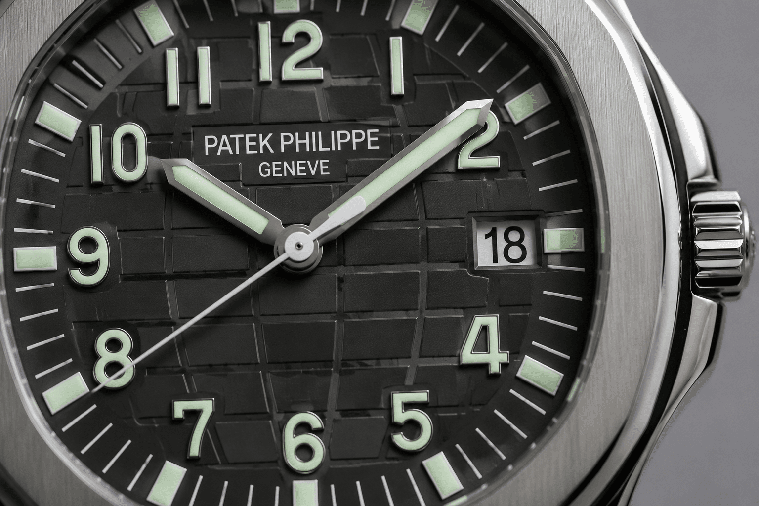 close-up of Aquanaut dial printing, lume, and date window alignment under controlled neutral lighting